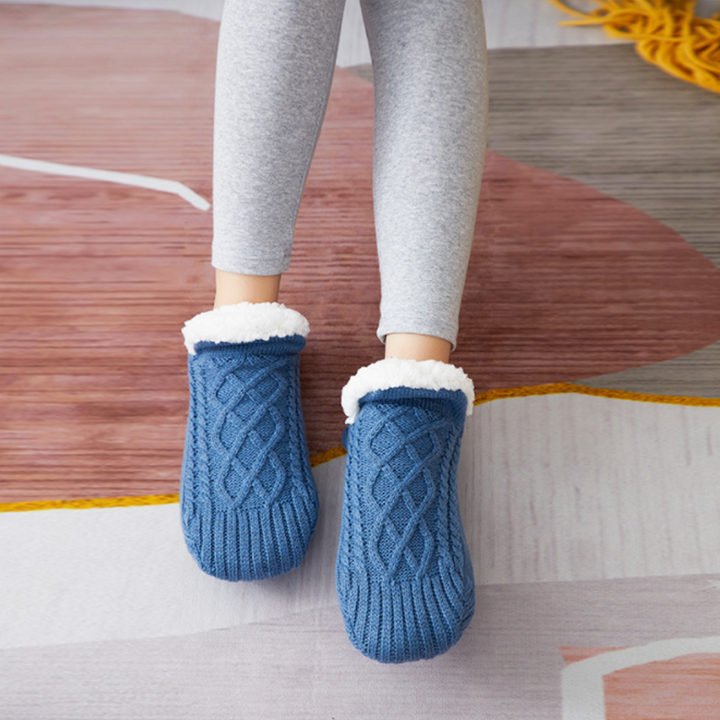 Unisex warm fluffy slipper socks in a neutral grey, designed for indoor wear and ultimatefoot comfort.