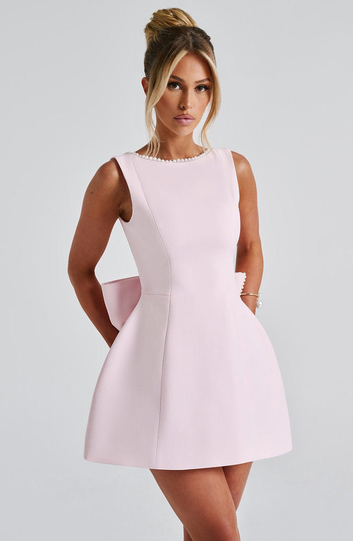 Black structured mini dress, perfect for a wedding guest, cocktail, or party occasion, sleek and stylish.
