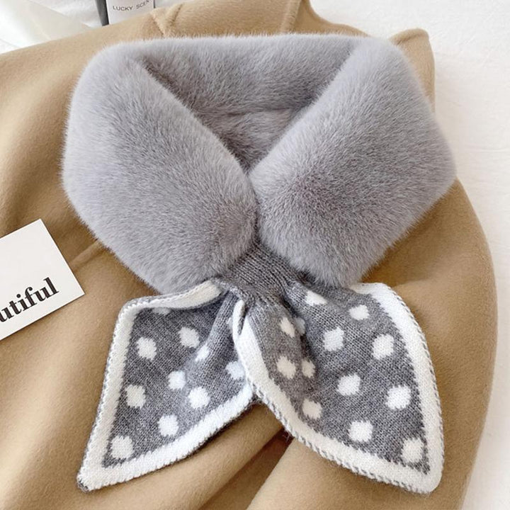 A folded thick plush winter scarf, highlighting its substantial and cozy feel.