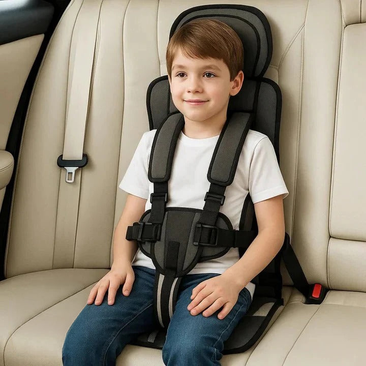 Compact child travel safety seat with 5-point harness for easy transport.