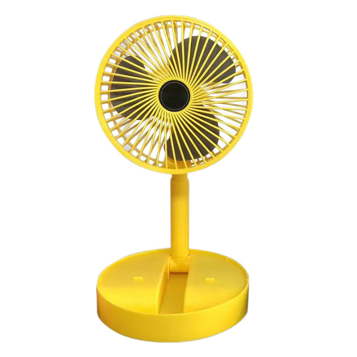White folding table fan, in a contemporary kitchen, keeping cool while cooking.
