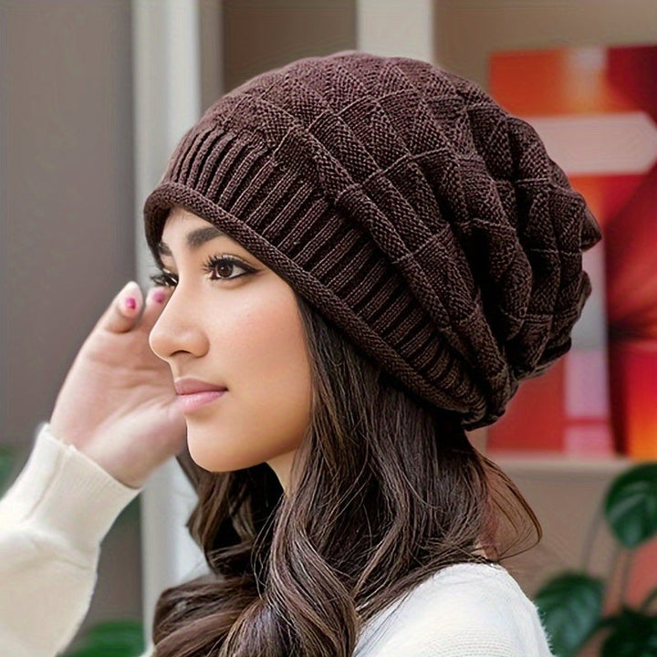 Stylish women's red knitted beanie, lightweight acrylic for spring/autumn travel.