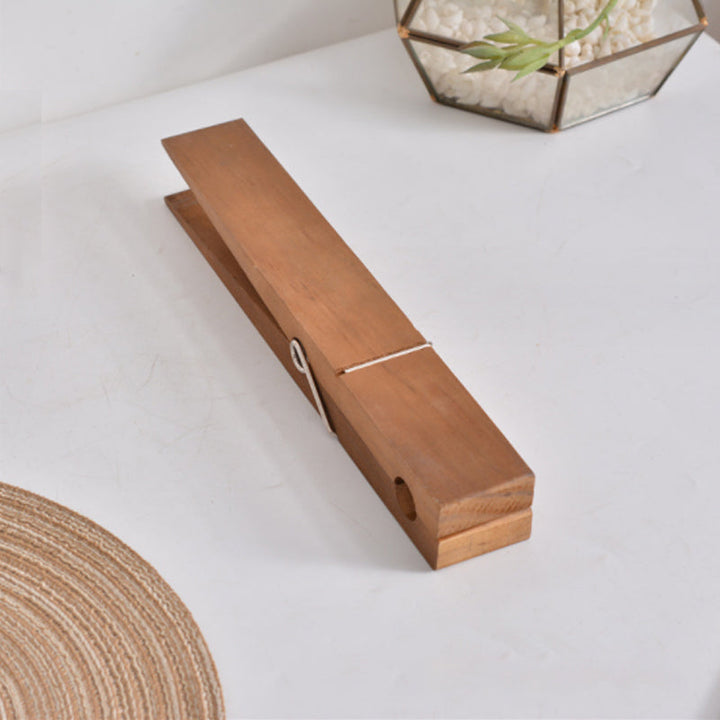 Decorative rustic clothespin towel rack for wall mounting, suits bathroom or laundry aesthetics.