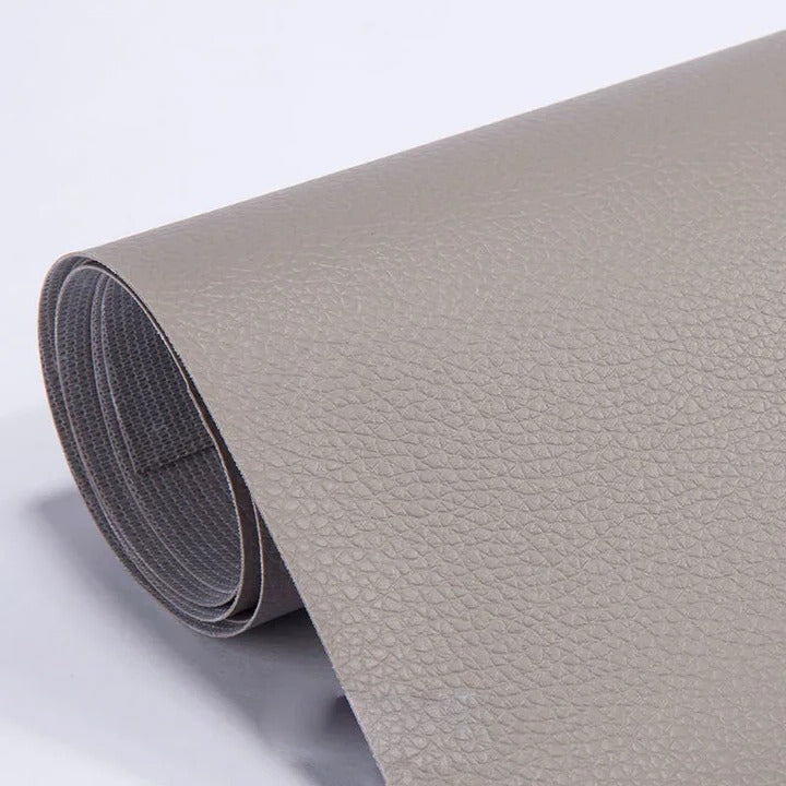DIY leather repair tape in black for patching tears on furniture & car seat upholstery.