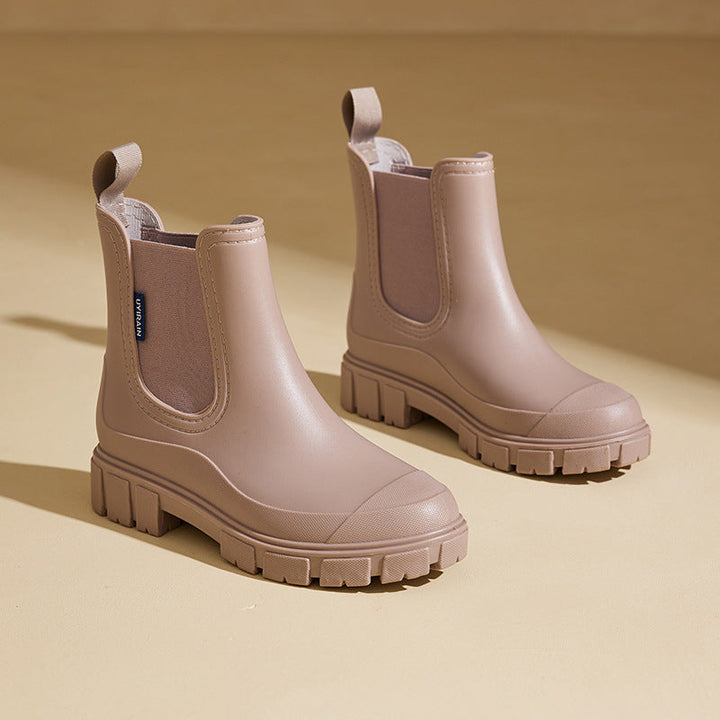Puddle-resistant Selora women's waterproof mid-height rain boots, ideal for wet autumn & winter weather.