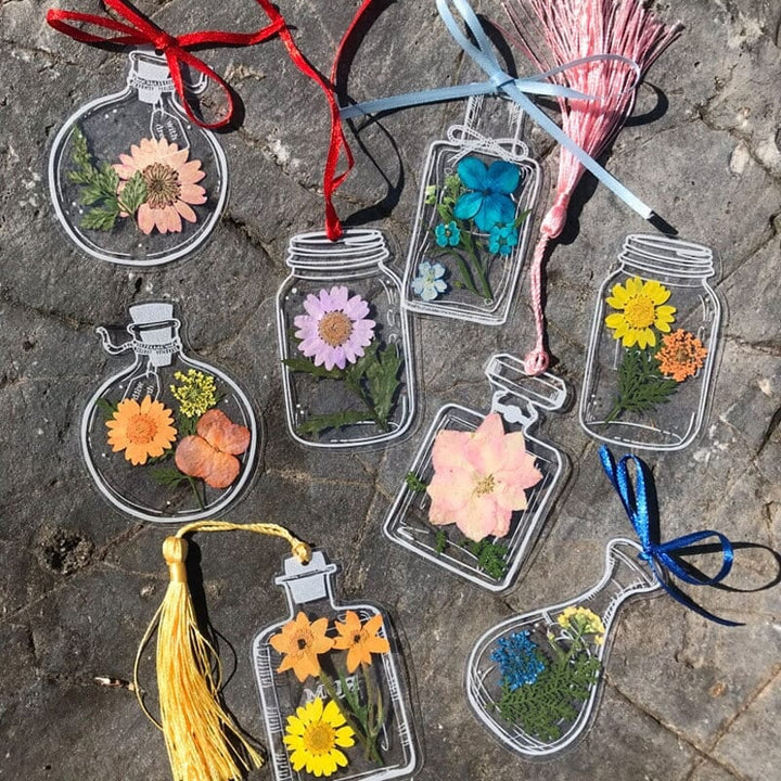 Transparent bookmark set for avid readers, each embedded with natural dried flowers & botanical elements.