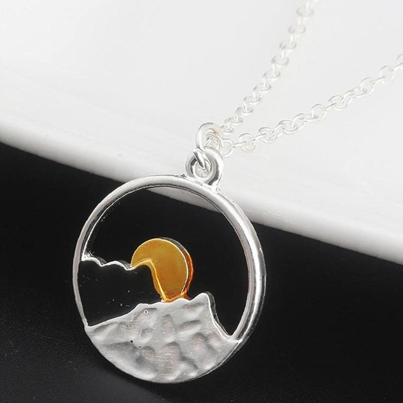 Gift-ready silver mountain couple necklace, celebrating outdoor beauty and shared adventures.