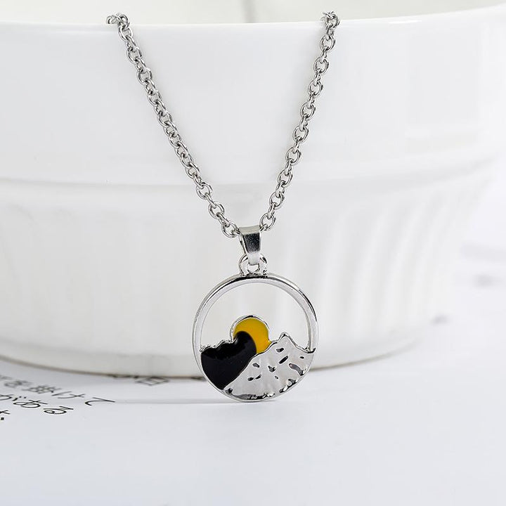 Unisex nature-inspired mountain jewelry, featuring a detailed landscape design in silver alloy.