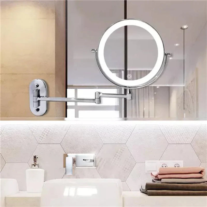 Silver rechargeable LED vanity mirror with adjustable lighting, 360° rotation, and various magnification options for precise 