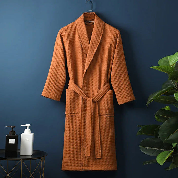 Folded waffle knit lounge robe in cream, highlighting its soft texture and lightweight feel