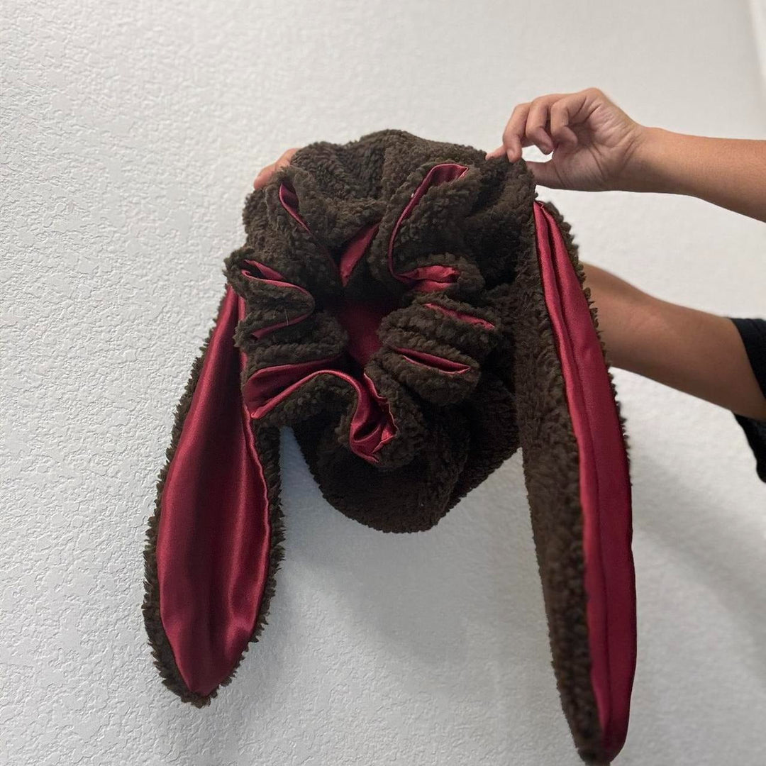 Cute pink plush bunny hat for women, a cozy bonnet ideal for lounge wear, sleep, or winter warmth.