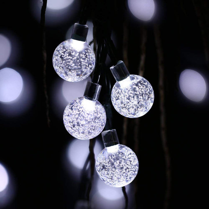 Packaged solar outdoor LED string lights, ready for installation in a garden or patio