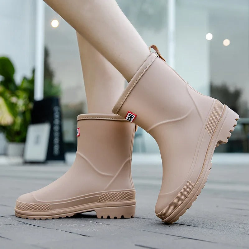 Green women's fashion ankle rain boots, waterproof & comfortable for staying dry in style.
