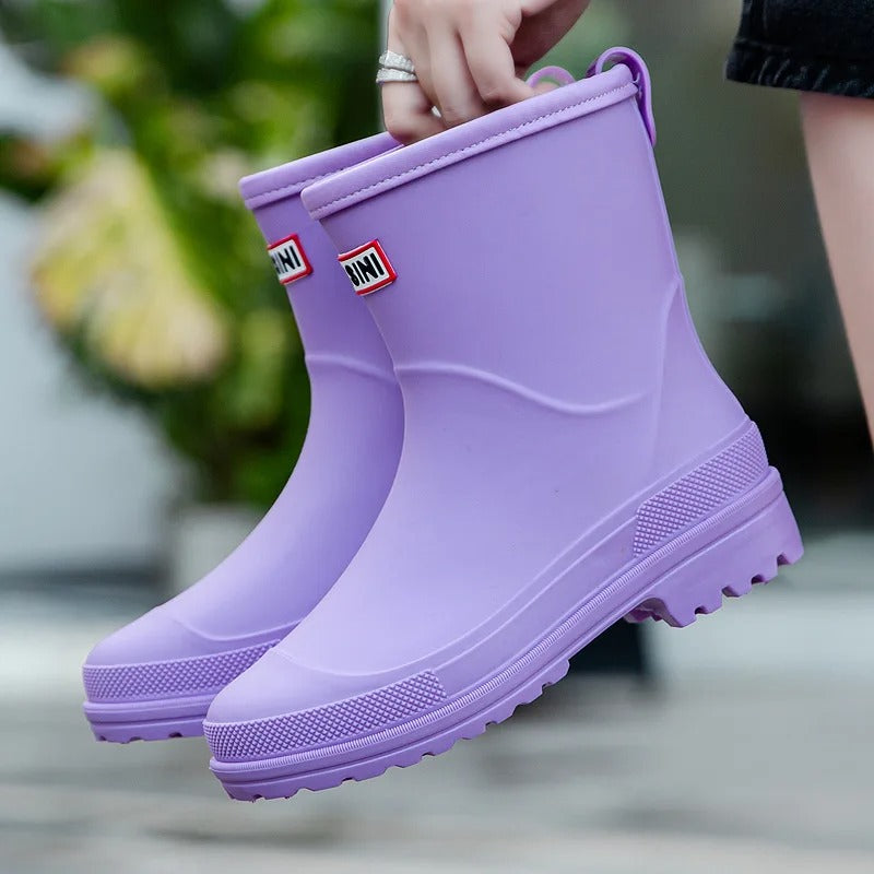 Beige women's waterproof slip-on ankle boots, perfect rain footwear for wet weather.