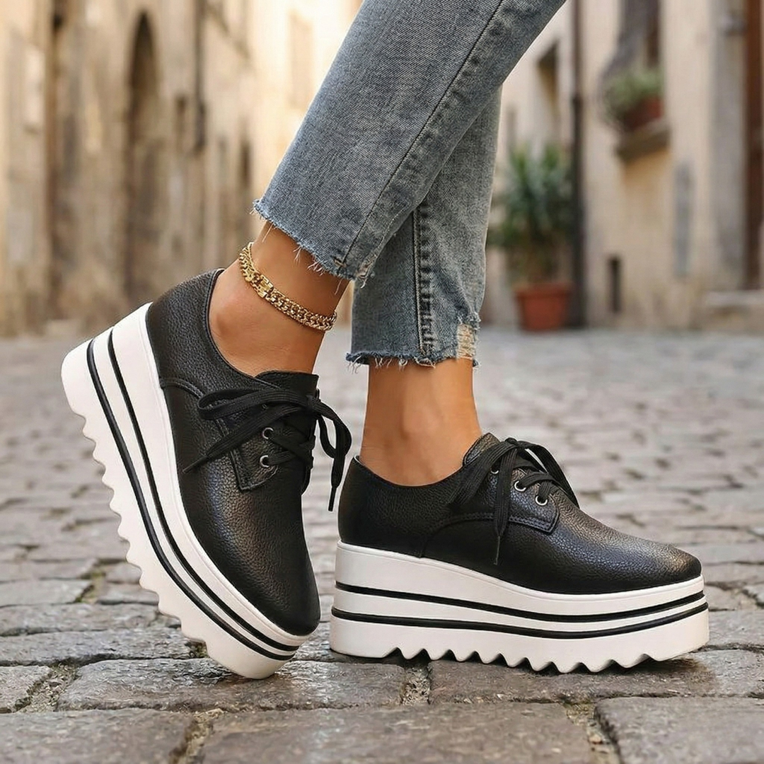 Stylish women's black platform oxford shoes with classic lace-up design, perfect for comfortable all-day wear.