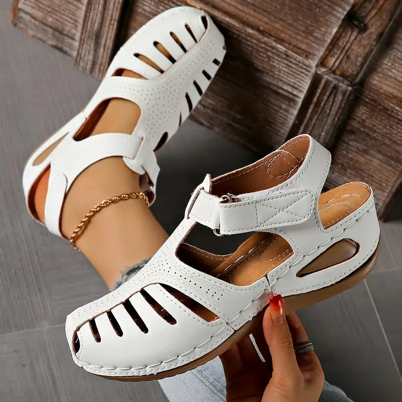 Chic women's everyday sandals with a comfortable flat design, perfect for stylish casual summer fashion.