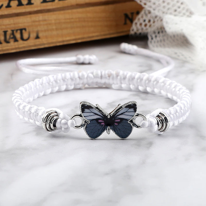Stylish unisex black woven bracelet with a small butterfly charm, adjustable for any wrist size.