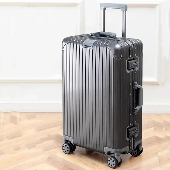 Durable unisex aluminum luggage featuring 360° spinner wheels, ideal for effortless airport navigation.