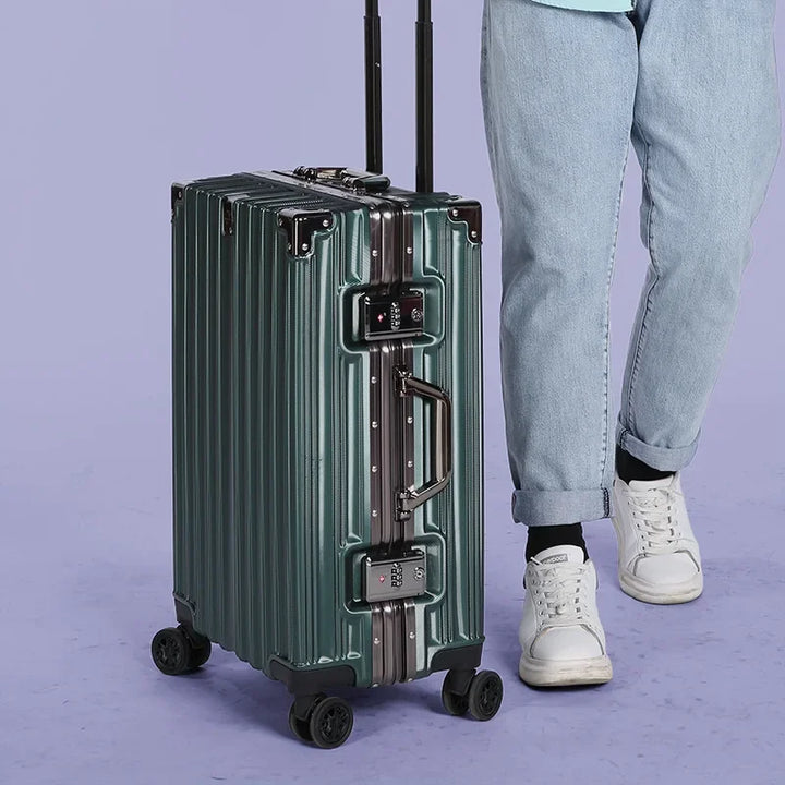Secure unisex black hardshell luggage, featuring an integrated aluminum frame & reliable latch closure system.