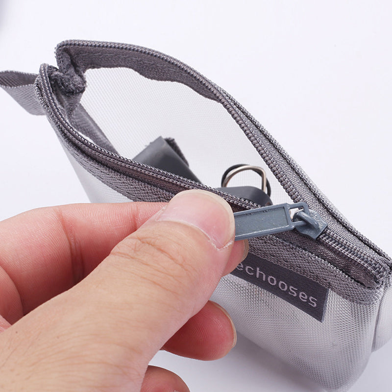 Compact mesh storage bag with zipper, ideal for pens, cables, or makeup in a backpack.