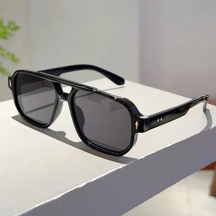 Accessory shot: unisex bold rectangular UV400 sunglasses, stylish and functional