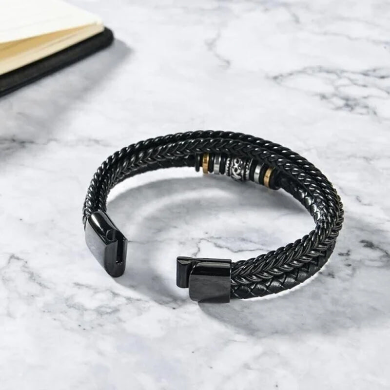 Stainless steel and braided leather double row bracelet, a durable and chic piece of men's jewelry.