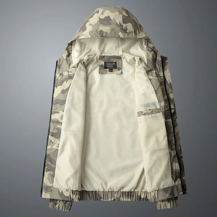 Back view of a unisex camouflage windbreaker jacket, emphasizing the full camo pattern and fit