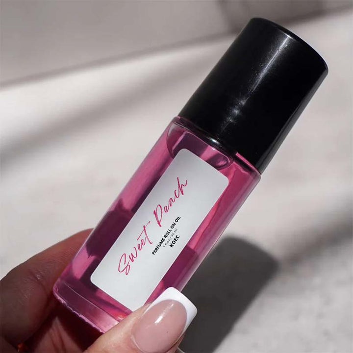 Unisex peach and vanilla scented roll-on fragrance oil, packaged beautifully, ideal for a thoughtful gift.