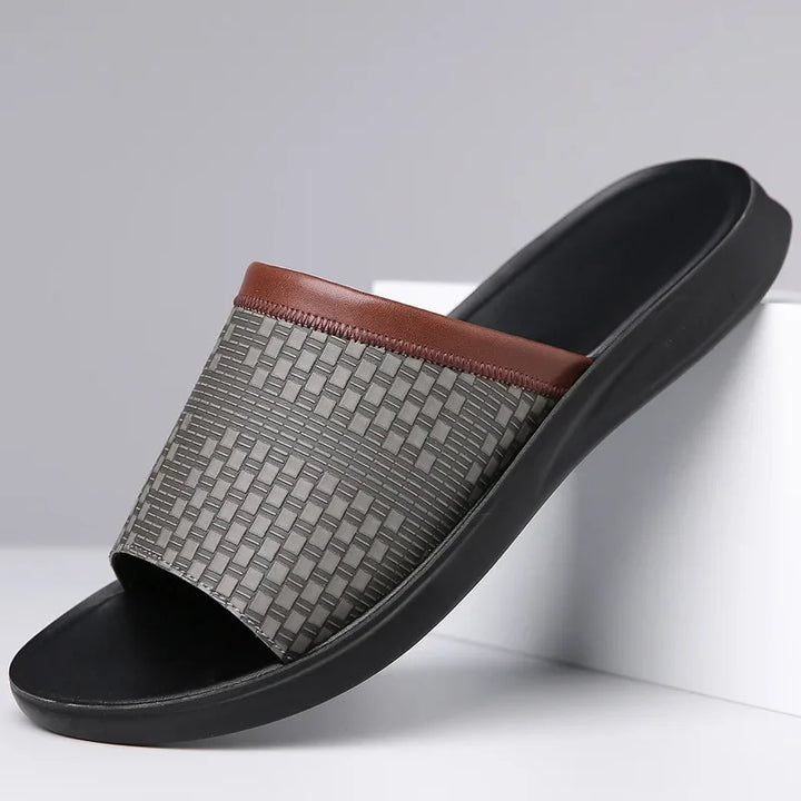 Close-up of the textured woven strap on unisex comfort slide sandals, highlighting craftsmanship