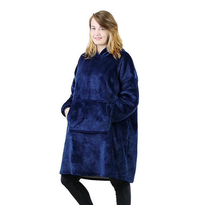 Cozy unisex hoodie, styled as a blanket sweatshirt, ideal for relaxing at home.