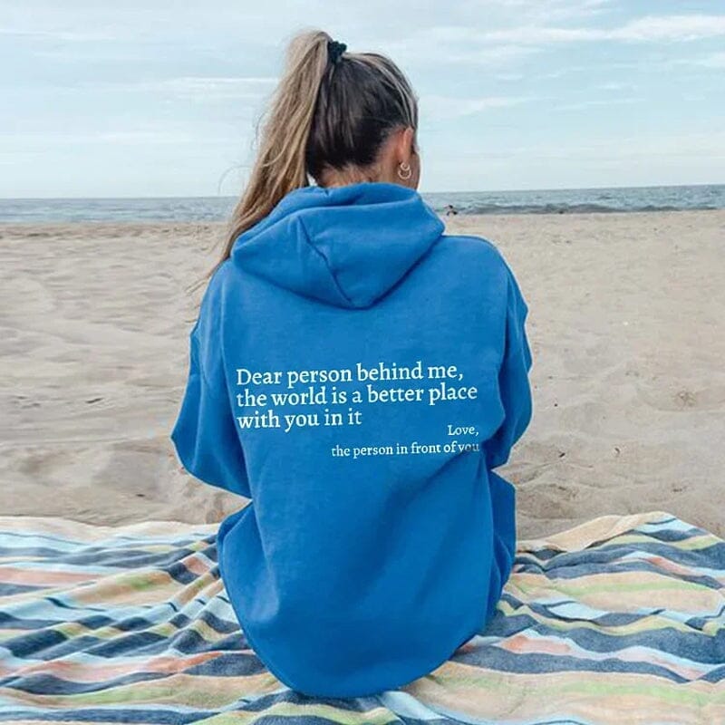 Folded 'Dear Person Behind Me' sweatshirt, black fabric, positive message clothing