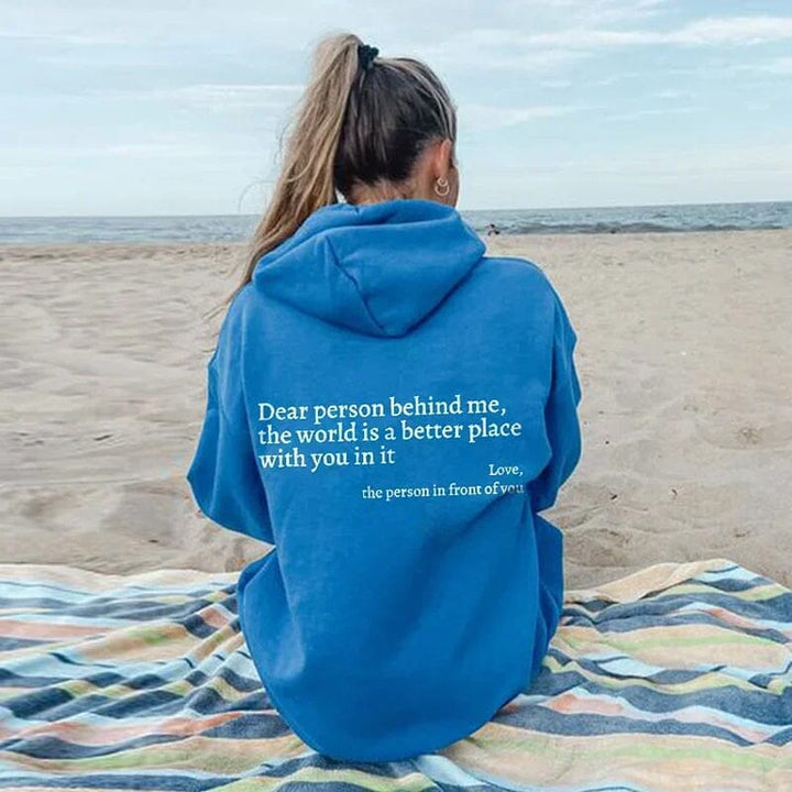 Folded 'Dear Person Behind Me' sweatshirt, black fabric, positive message clothing