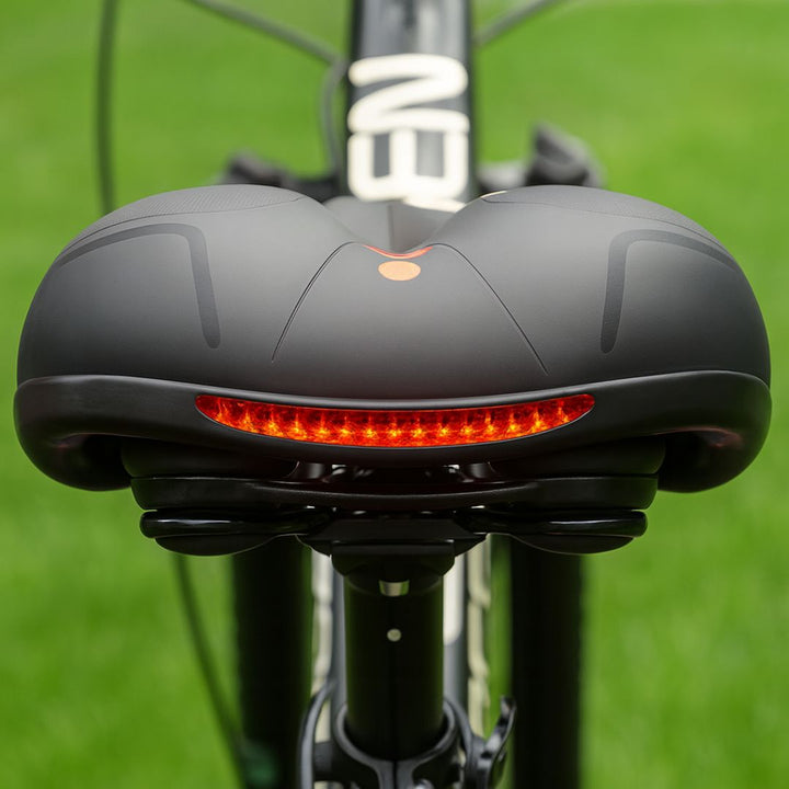 Waterproof & durable bike saddle, ergonomic suspension design for comfortable commuting.