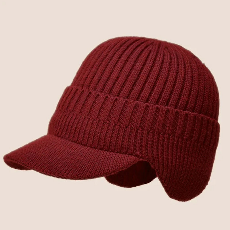 Warm winter headwear: gray knit beanie with extended ear flaps, unisex design.