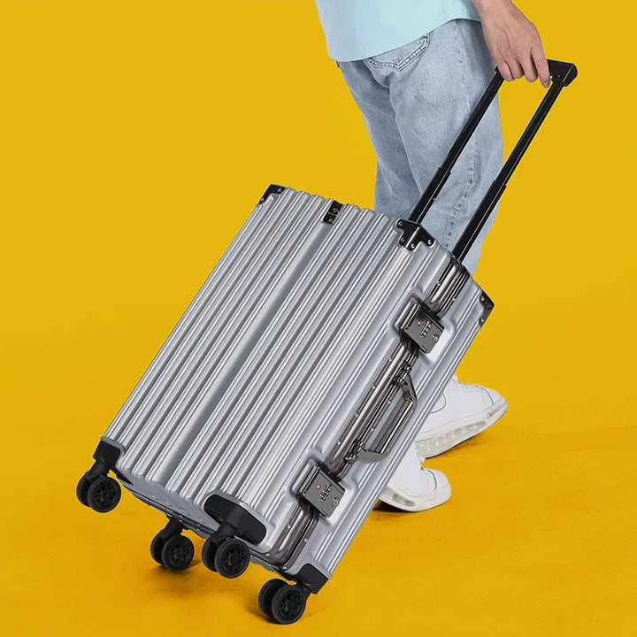 Easy-to-maneuver unisex hard shell suitcase with smooth spinner wheels, aluminum frame, and secure lock.