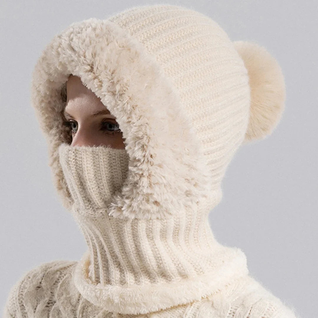 Unisex model wearing a Heather Gray Winter Knit Sherpa Lined Hood in snow