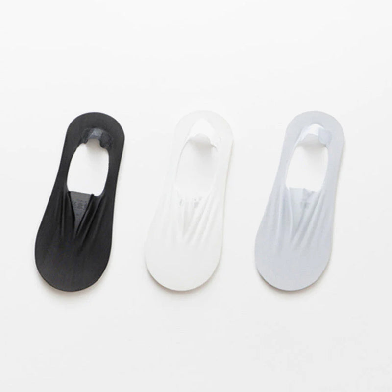 Unisex invisible socks paired with casual shoes, showcasing their no-show appeal