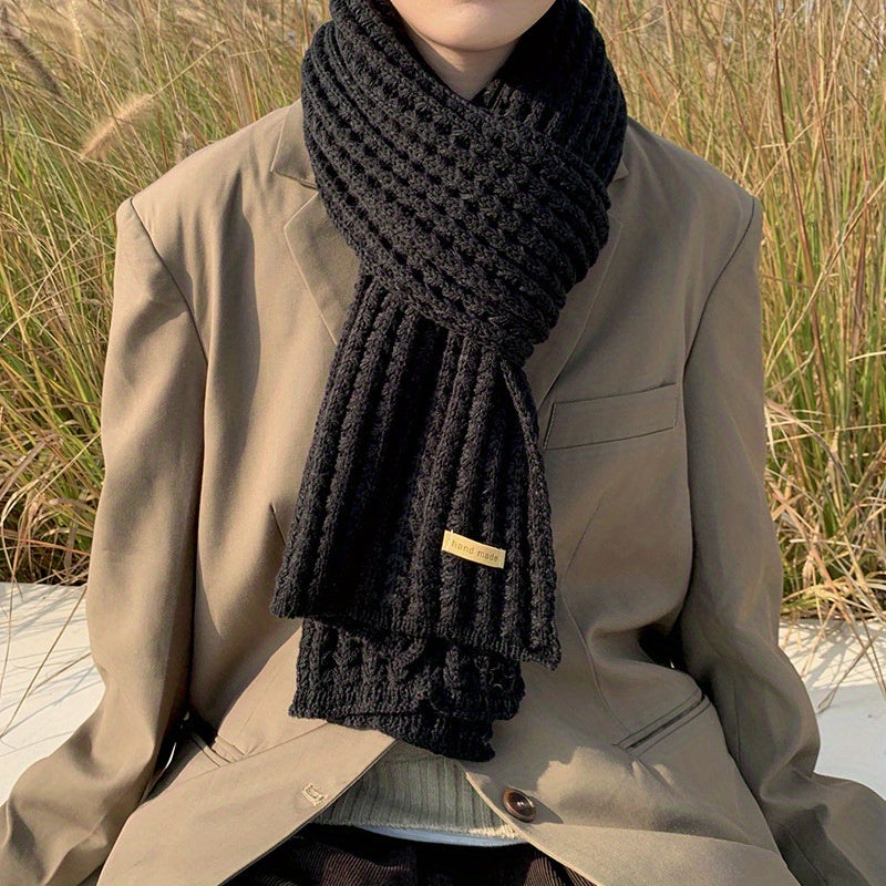 Soft, cozy unisex knitted scarf with eye-catching geometric pattern, ideal for cold weather comfort.