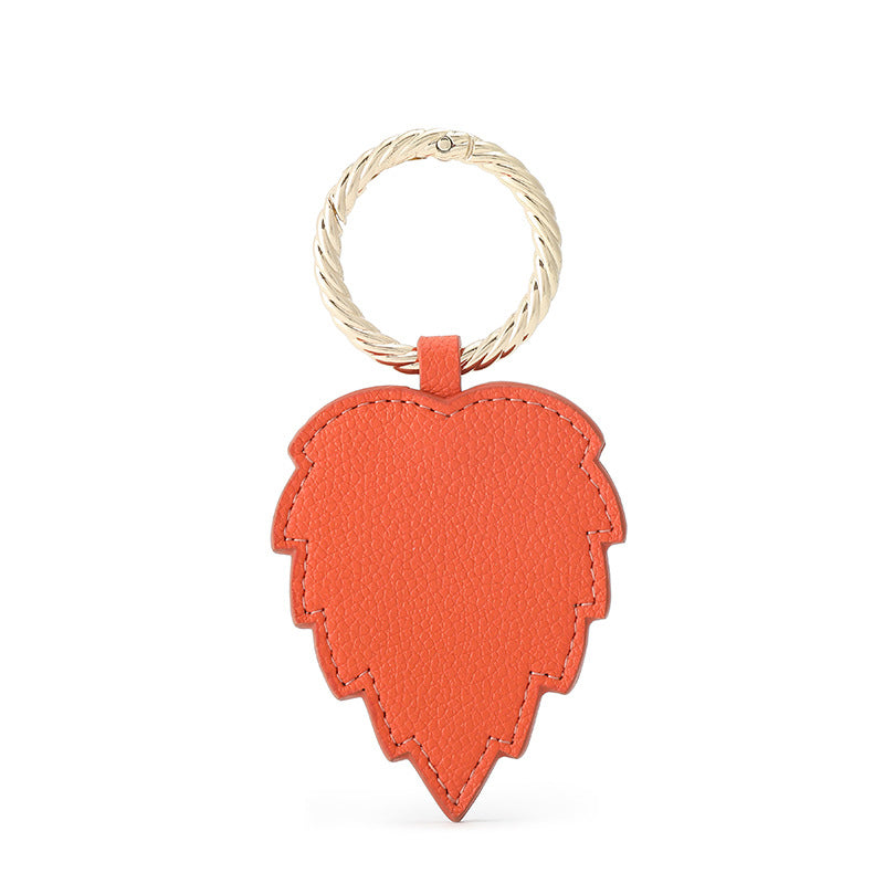 Showcasing the strong magnetic grip of the hat holder clip on a denim jacket.