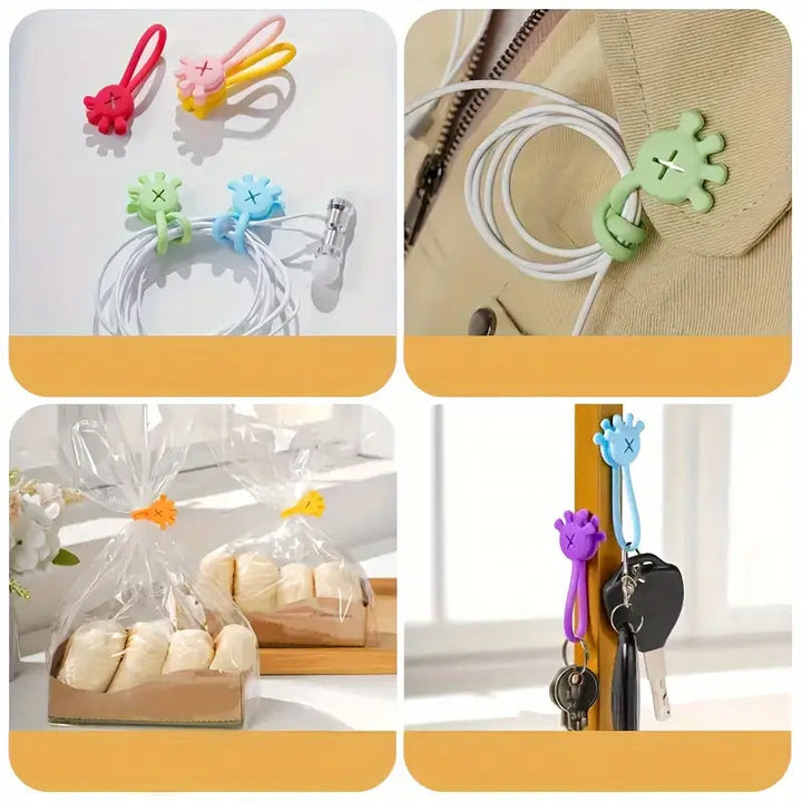Front view of a magnetic silicone cable organizer clip, gray, showcasing its sleek design and magnet.