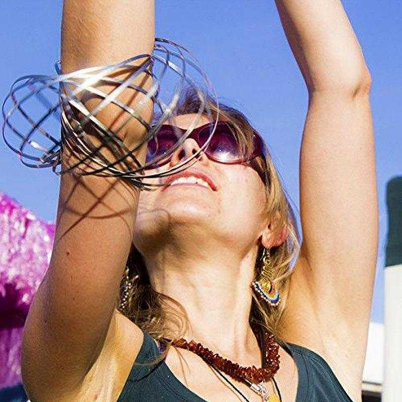 Close-up of a silver spinning spiral fidget bracelet, highlighting its intricate metal design.