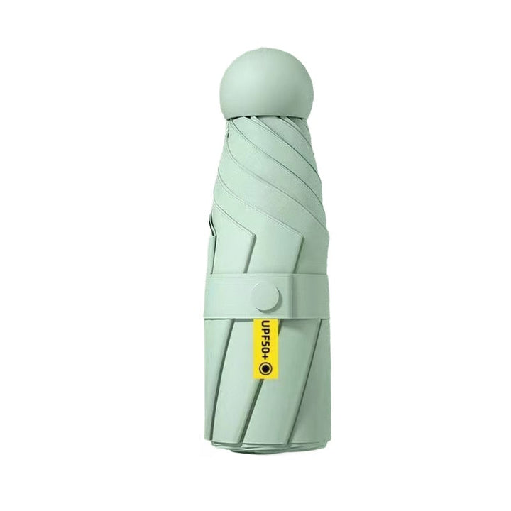 Unisex mini umbrella in a car's glove compartment, ideal for emergency rain protection