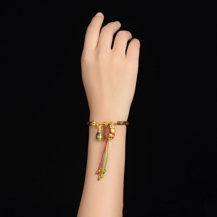 Close-up of Mythical Reincarnation Cord Bracelet, showing intricate mythological design
