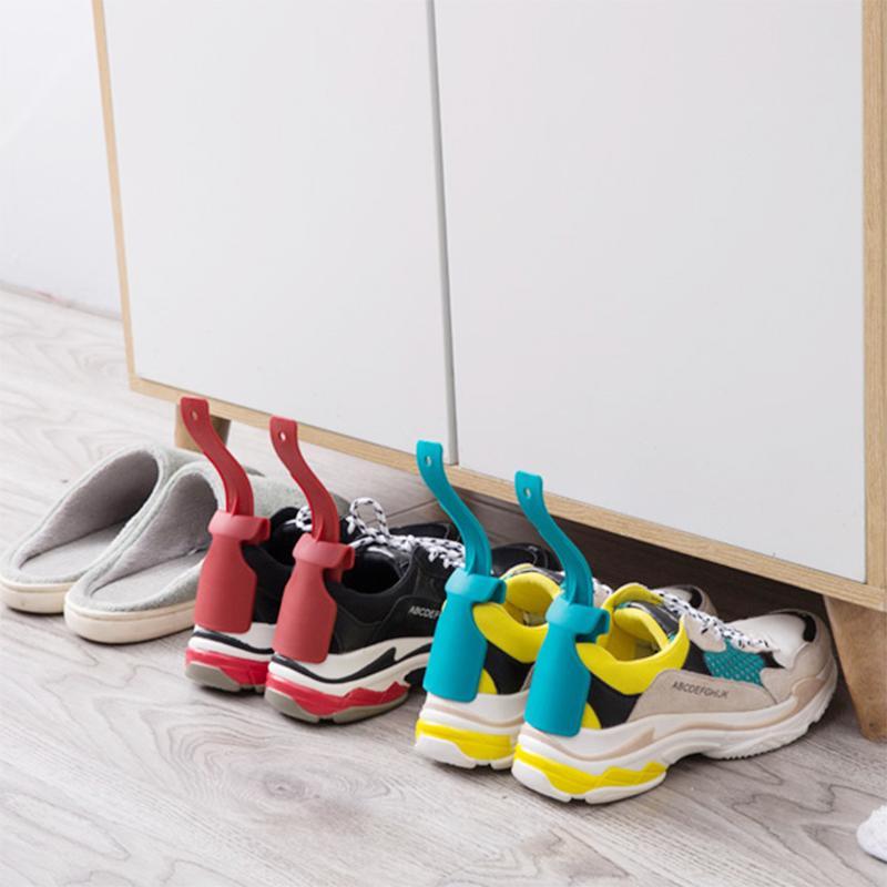 Portable shoe horn accessory in a neutral color, assists with putting on shoes quickly and easily