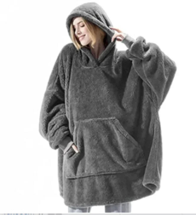 Cozy oversized hoodie blanket, a comfortable loungewear essential for winter warmth & relaxation.