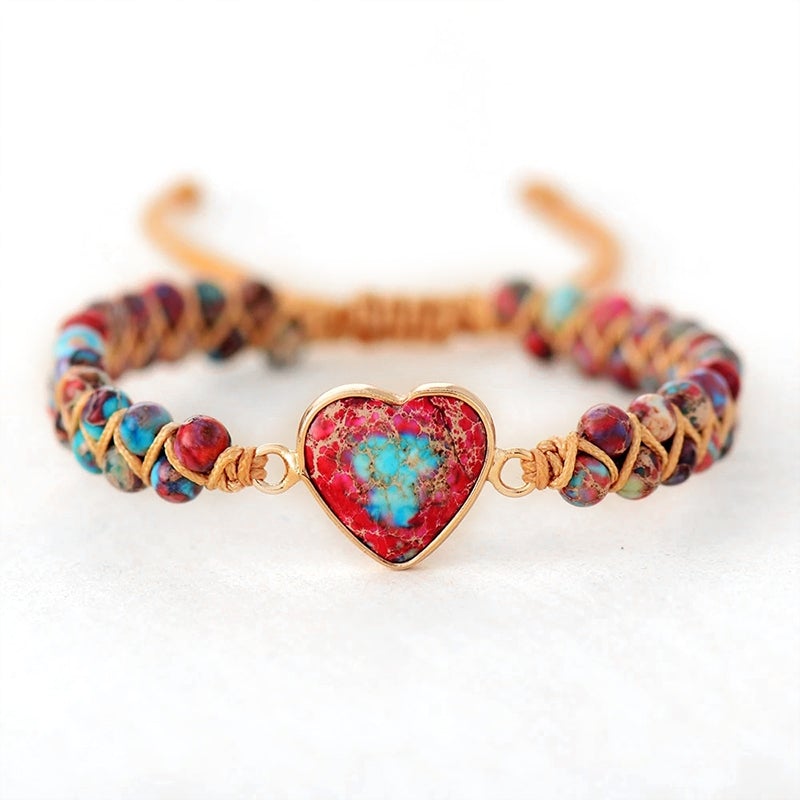 Artistic flat lay of a Unisex Passionate Heart Charm Bracelet, ideal spiritual gift