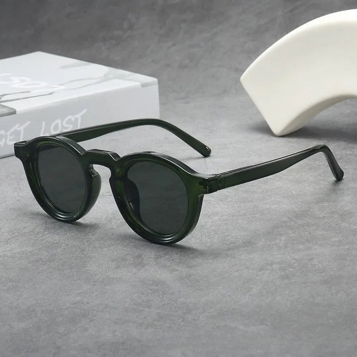 Comfortable unisex round eyewear with scratch-resistant tinted lenses.