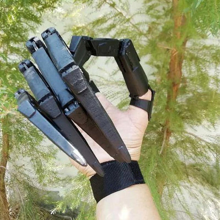 Black skeleton finger extensions for Halloween costumes, providing a horror effect