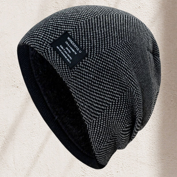 Unisex thermal knit beanie hat in forest green, laid flat to showcase its durable knit construction.