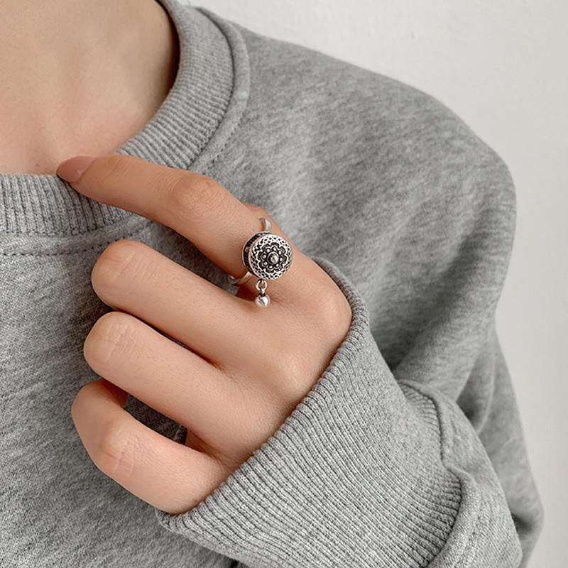 Close-up of Tibetan Prayer Wheel Spin Ring, unisex copper jewelry with intricate design
